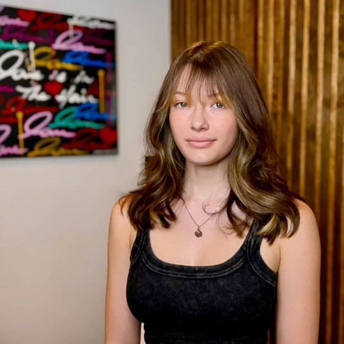 Medium-length thick hair featuring bangs.