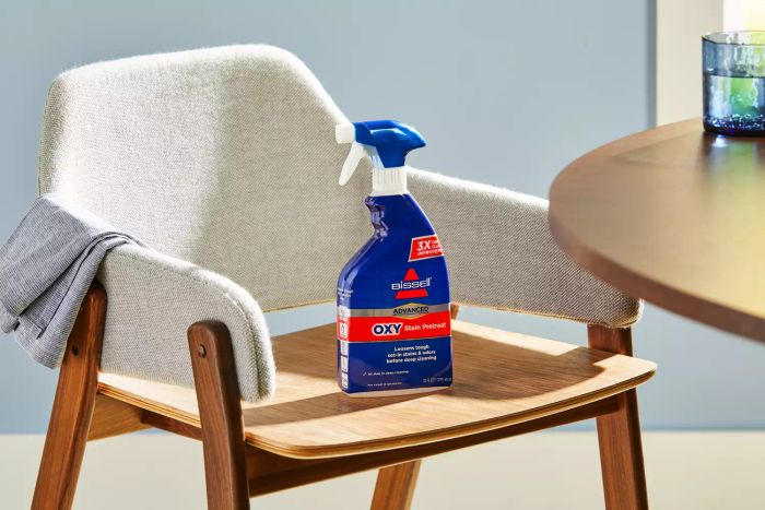 Bissell Advanced Oxy Stain Pretreat showcased on a chair