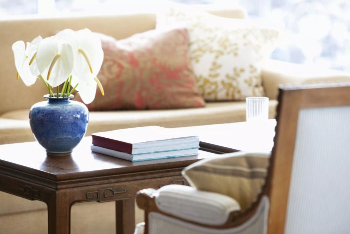 books and flowers on coffee table