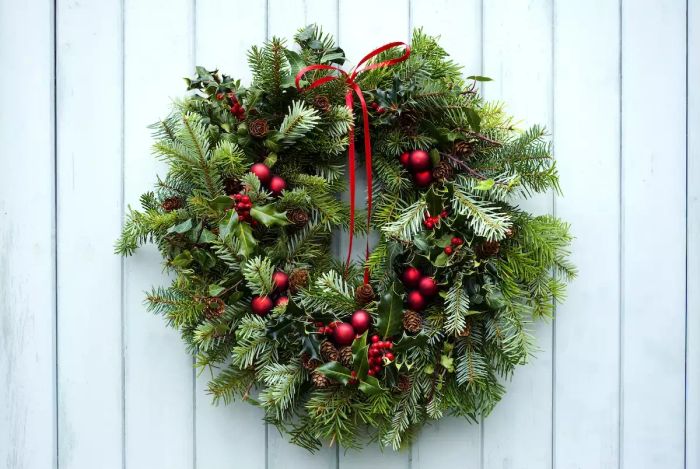 festive green wreath adorned with a vibrant red bow