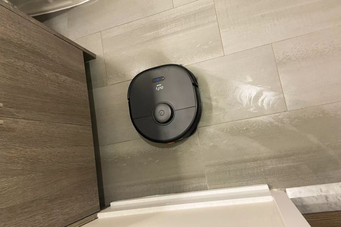 The Eufy Clean X9 Pro Robotic Vacuum efficiently cleans a bathroom floor.
