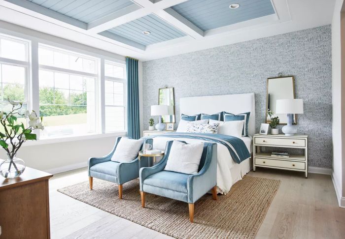 Bedroom featuring a wallpaper accent wall
