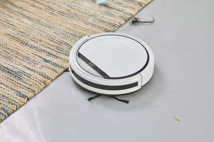 The ILIFE V3s Pro Robot Vacuum Cleaner transitions smoothly from linoleum to a rug, handling both hair and Cheerios effortlessly.
