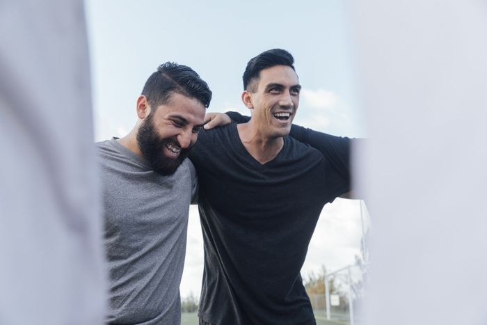 two men with their arms around each other