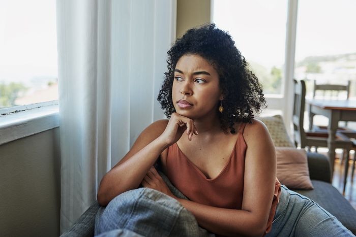 a woman gazing out of a window
