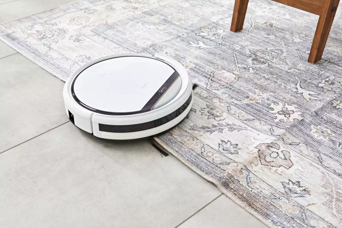 The ILIFE V3s Pro Robot Vacuum Cleaner effortlessly transitions from tile floors to carpeted areas.