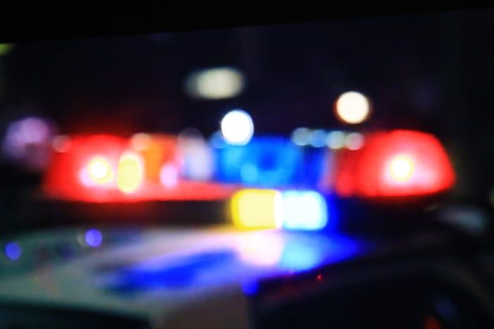 A close-up image of hazy police car lights