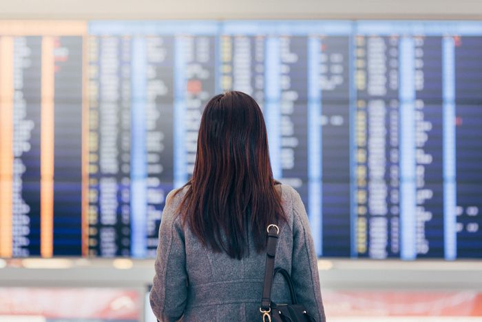 a person checking a flight schedule