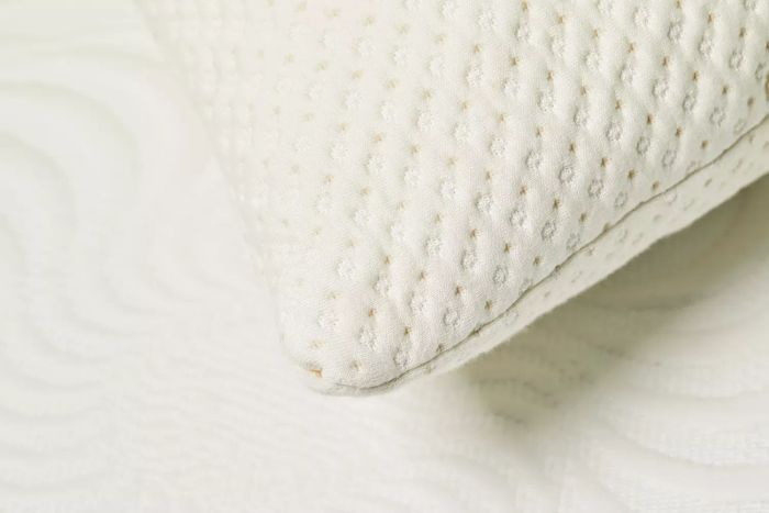A close-up view of the corner of a Snuggle-Pedic Adjustable Shredded Memory Foam Pillow