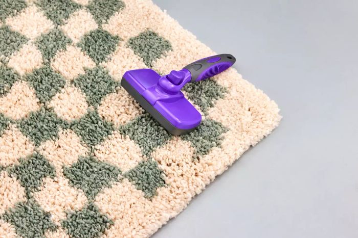 A brush on the AllModern Walker Checkered Shag Area Rug