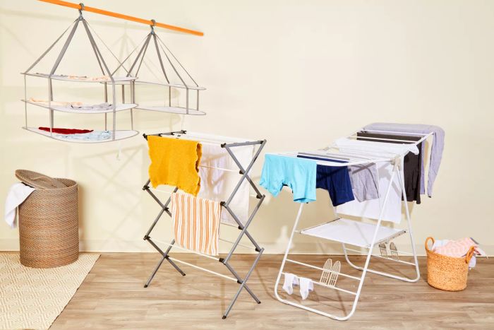 A trio of premium garment drying racks showcased side by side, each adorned with freshly laundered clothes.