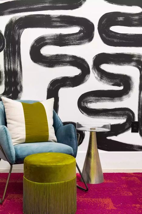 accent wall featuring abstract painted designs