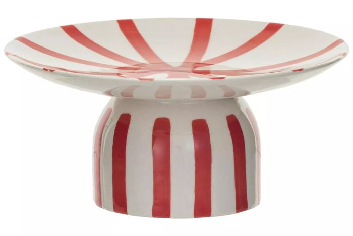This hand-painted stoneware pedestal from Creative Co-Op features a striking red and cream striped design, evoking the sweet look of a candy cane. It’s the perfect piece for serving appetizers or showcasing your favorite items on a dining table. Made from durable stoneware, it’s also dishwasher safe for easy cleanup.