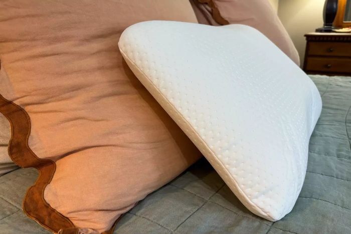 The Tempur-Pedic TEMPUR-Symphony Pillow placed on a bed