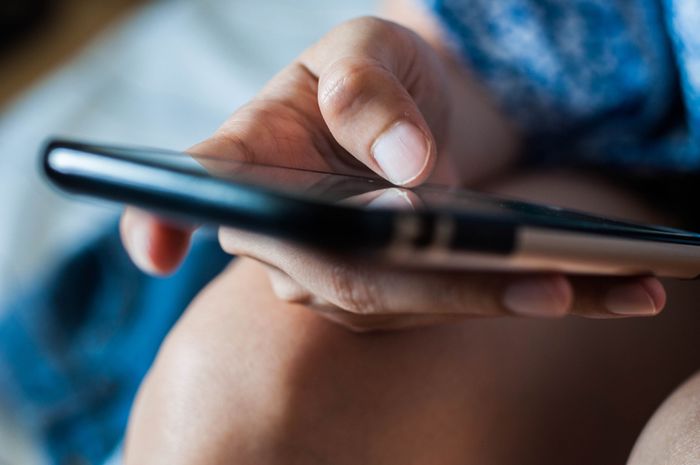 close-up of a hand holding a phone