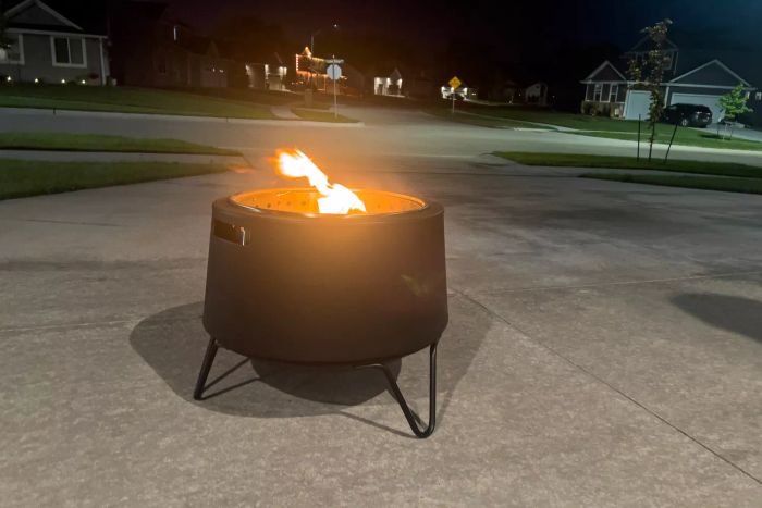 A flame burning inside the Tiki Social Smokeless Fire Pit