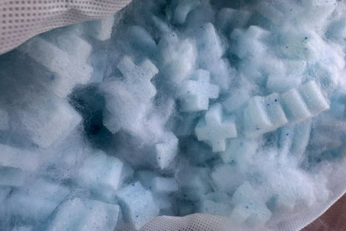 A detailed view of the stuffing inside the Coop EdenCool+ Adjustable Pillow