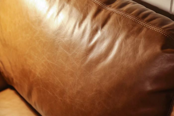A close-up shot of the Pottery Barn Turner Square Arm Leather Sofa cushion.