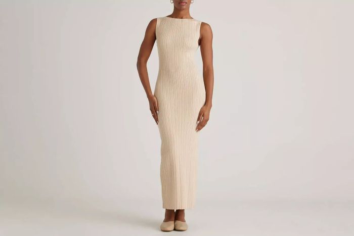 A stylish Cotton Cashmere Ribbed Sleeveless Midi Dress that combines the perfect balance of softness and sophistication for any occasion.
