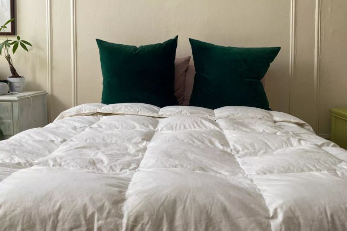 A bed styled with the Fluff Co Down Blended Comforter