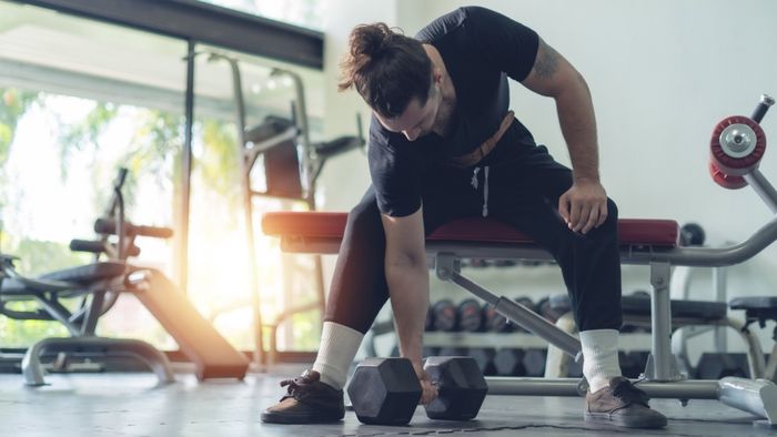 man with dumbbell