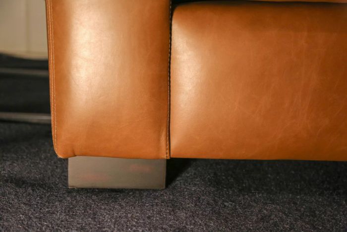 The leg design of the Pottery Barn Turner Square Arm Leather Sofa.