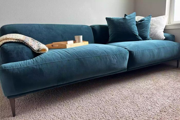 The Article Abisko Sofa in blue displayed in a living room setting.