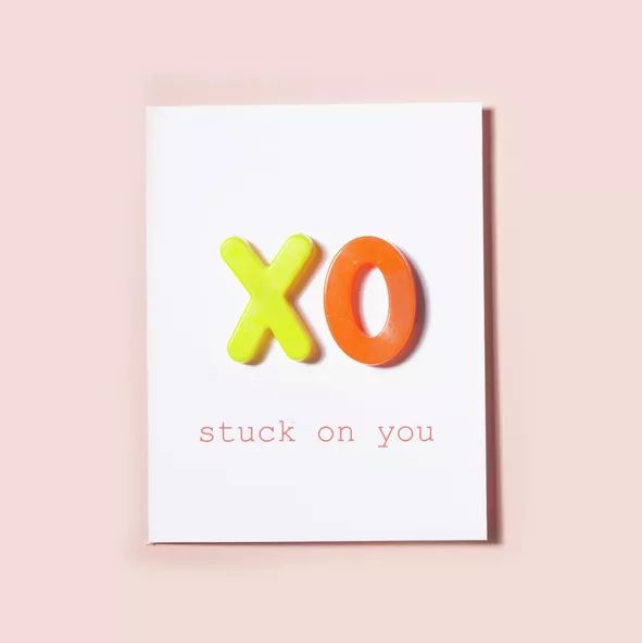 Homemade Valentine’s cards featuring fridge magnets with the phrase 