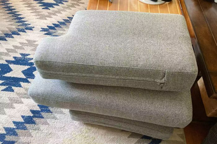 The cushions of the BenchMade Modern Skinny Fat Sectional placed on a rug