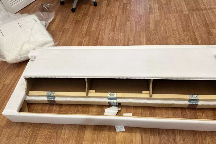A part of the IKEA Uppland Sofa placed on a wooden floor