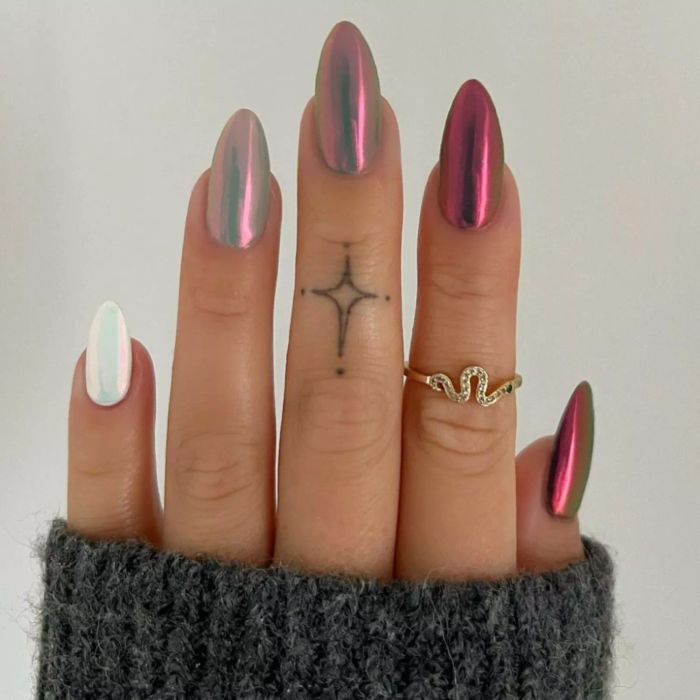 A gradient metallic manicure blending multiple shimmering tones.