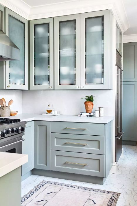 Blue cabinets kitchen with hexagonal tiles