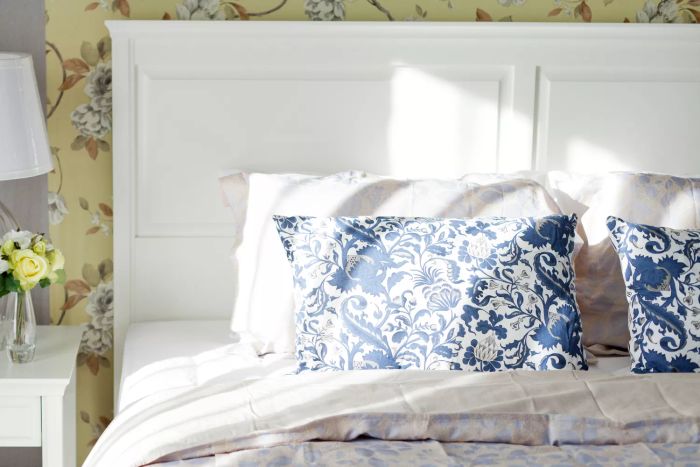 bed adorned with white sheets