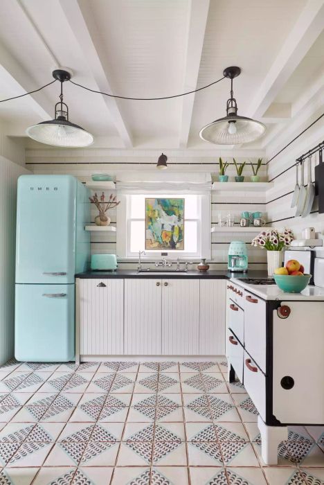 Kitchen with a blue refrigerator