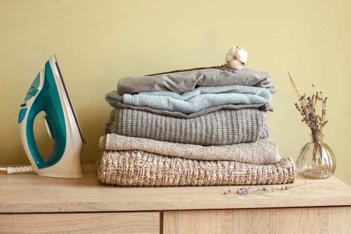 A pile of freshly laundered clothes at home. A visual representation of laundry, cleaning, and household chores. Ironing involved.