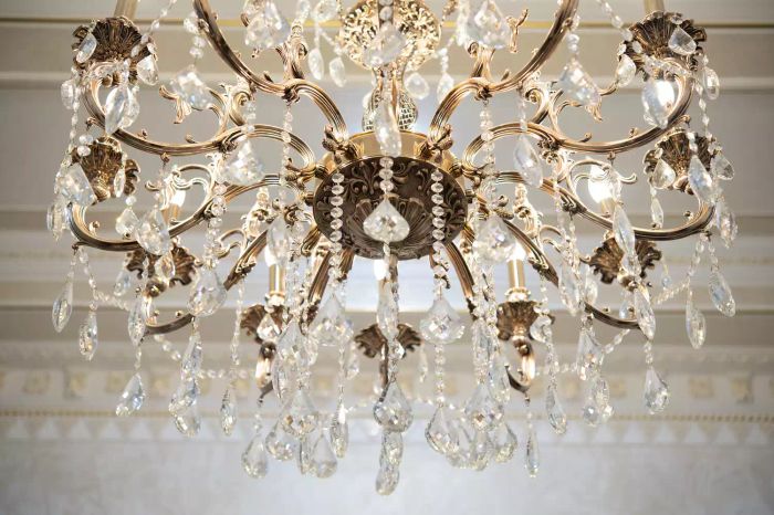 A stunning close-up view of a crystal chandelier with a bokeh effect, captured from below