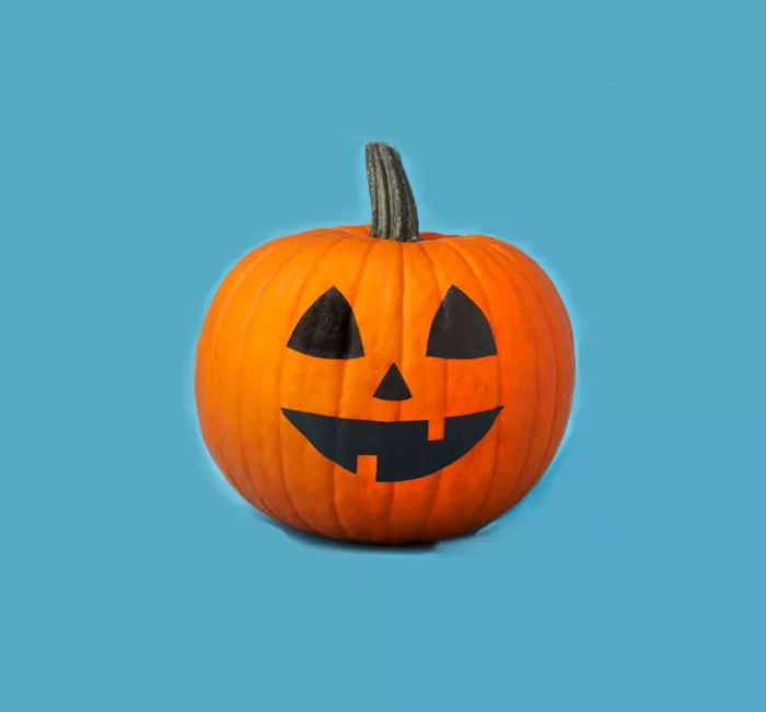 Easy, no-carve pumpkin ideas – create a simple smiling jack-o-lantern.
