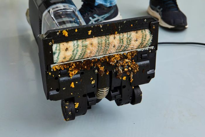 A close-up shot of the Bissell CrossWave HydroSteam Plus's underside after it has cleaned up a spill.