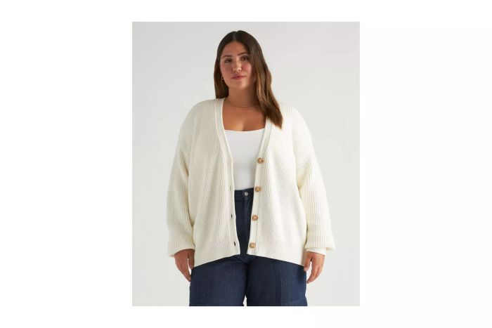 A person modeling the Quince 100% Organic Cotton Oversized Boyfriend Cardigan