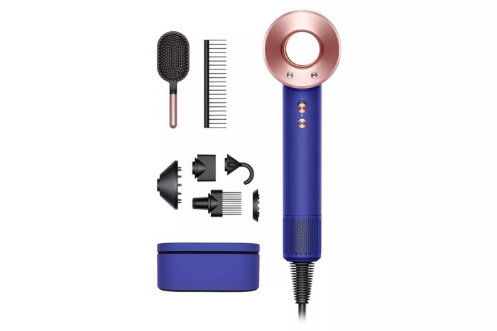 A blue and gold Dyson Supersonic Hair Dryer with its attachments displayed