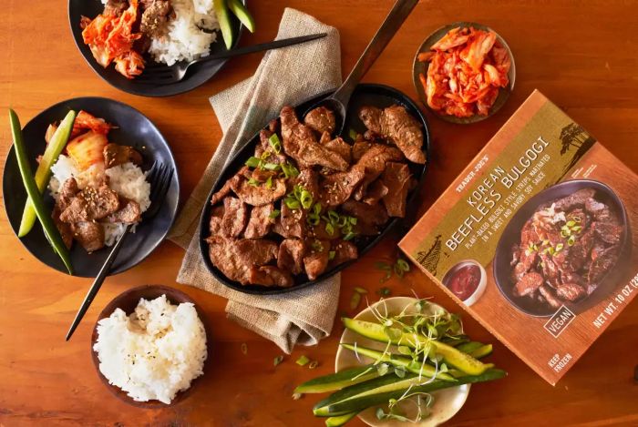 A photo of Trader Joe's Korean Beefless Bulgogi served with rice and bowls