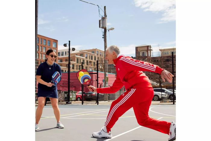 People enjoying a game of pickleball using the Nettie Pickleball Paddle Set