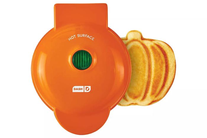 The Amazon DASH DMWP001OR Mini Waffle Maker is perfect for making individual waffles, hash browns, or keto chaffles. Featuring easy-to-clean, non-stick surfaces and a 4-inch size, this orange pumpkin-colored maker offers convenience and great results every time.
