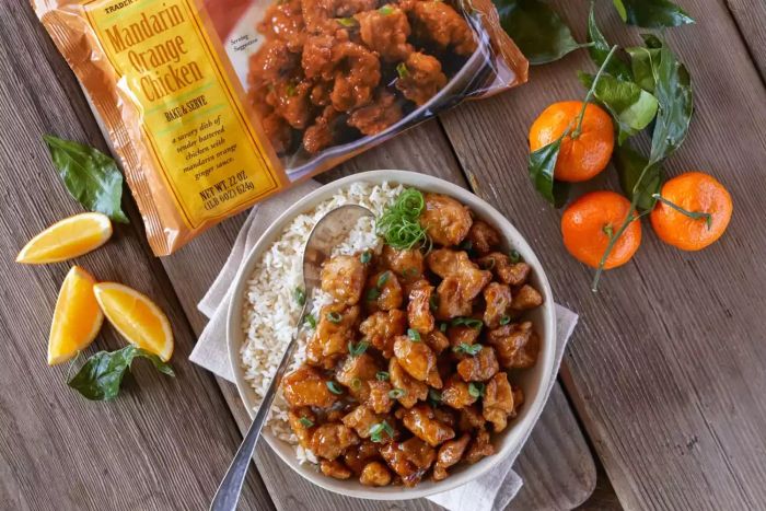 A photo of Trader Joe's Mandarin Orange Chicken served in a bowl with rice