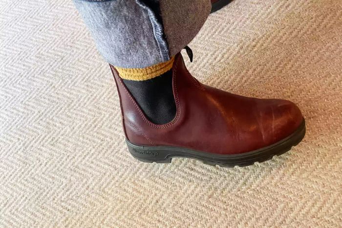 A person is seen wearing the Blundstone #1352 Women's Originals High Top Boots