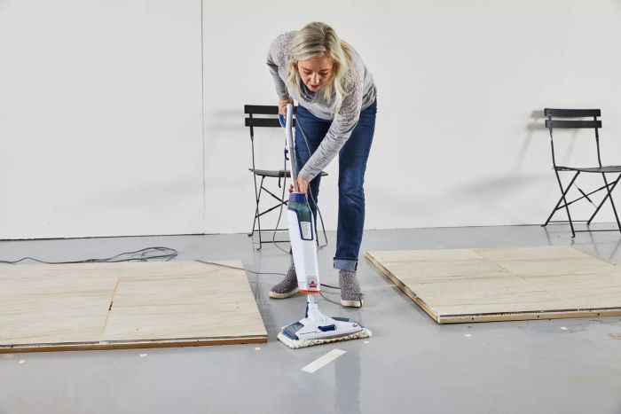 Person cleaning floor with Bissell 1806 PowerFresh Deluxe Scrubbing & Sanitizing Steam Mop