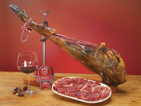 Jamon Iberico de Bellota refers to a premium type of Spanish ham, originating from the Iberian Peninsula. It’s produced in a small region straddling the Spanish-Portuguese border, where the black Iberian pigs feed exclusively on acorns, which imparts a distinct, earthy flavor to the meat. Unlike other pigs that are fed a grain-based diet to speed up their growth, these pigs enjoy free-range living in oak groves, which enriches the depth of the ham's flavor.