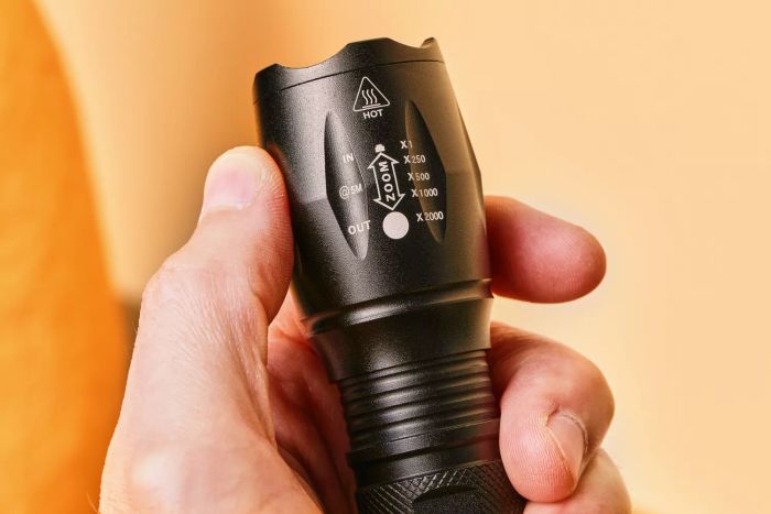 A close-up view of the settings on the GearLight S100 LED Tactical Flashlight.