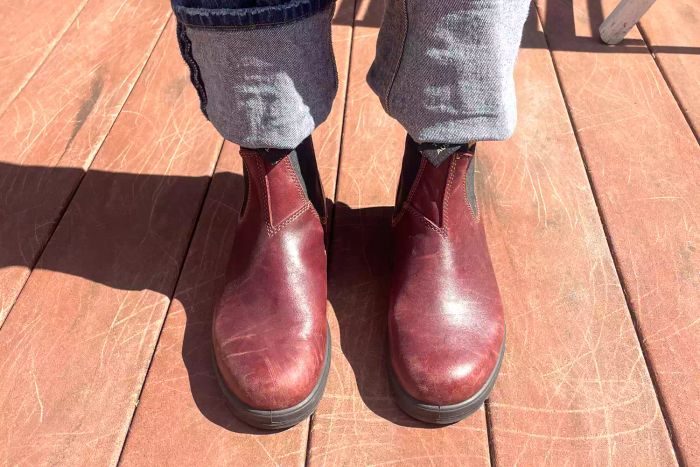 A person is seen wearing the Blundstone #1352 Women's Originals High Top Boots outdoors