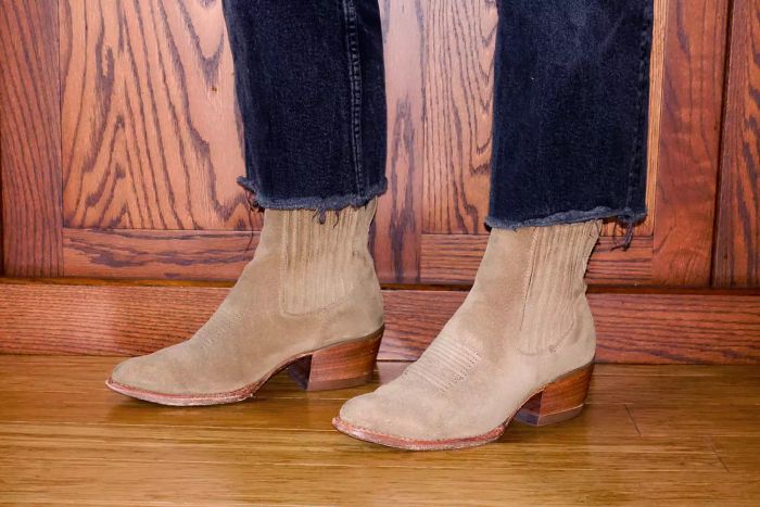 A person pairs the Tecovas The Taylor Chelsea Boots with a pair of jeans